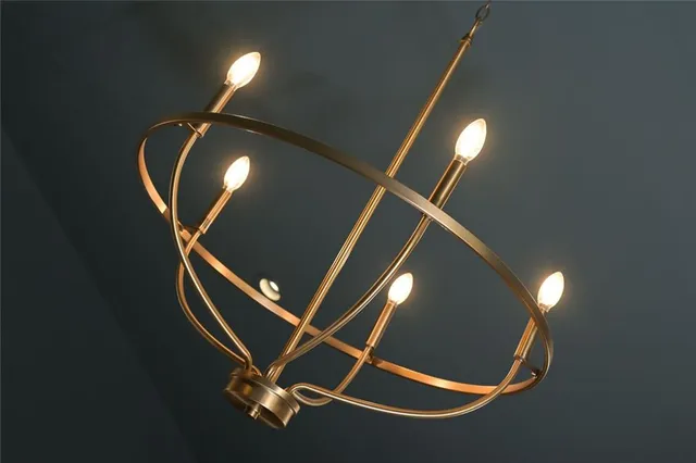 a room with gym equipment and wooden floor