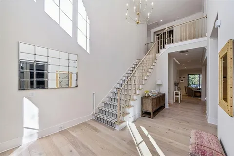 a view of entryway with livingroom and stairs
