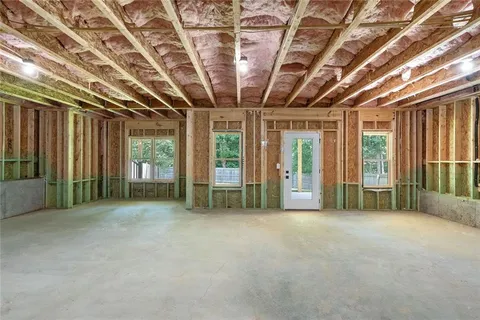 a view of an empty room with windows