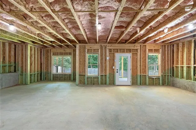 a view of an empty room with windows