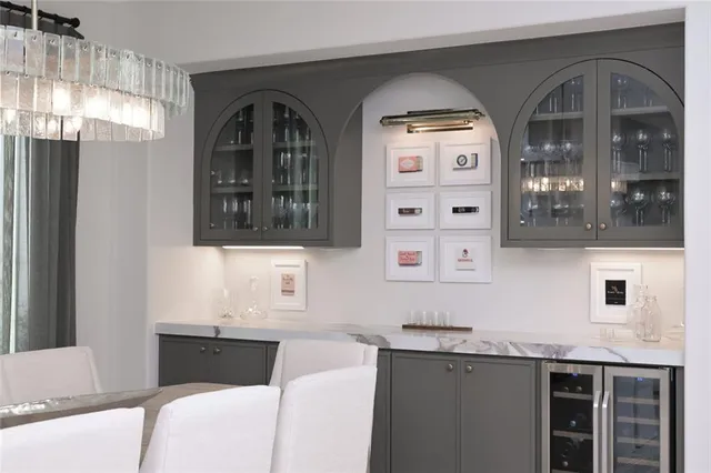 a bathroom with double vanity sink and two mirror