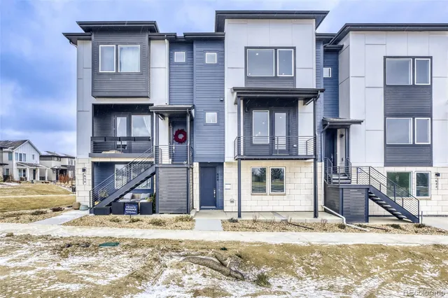 a view of a house with a snow in the background