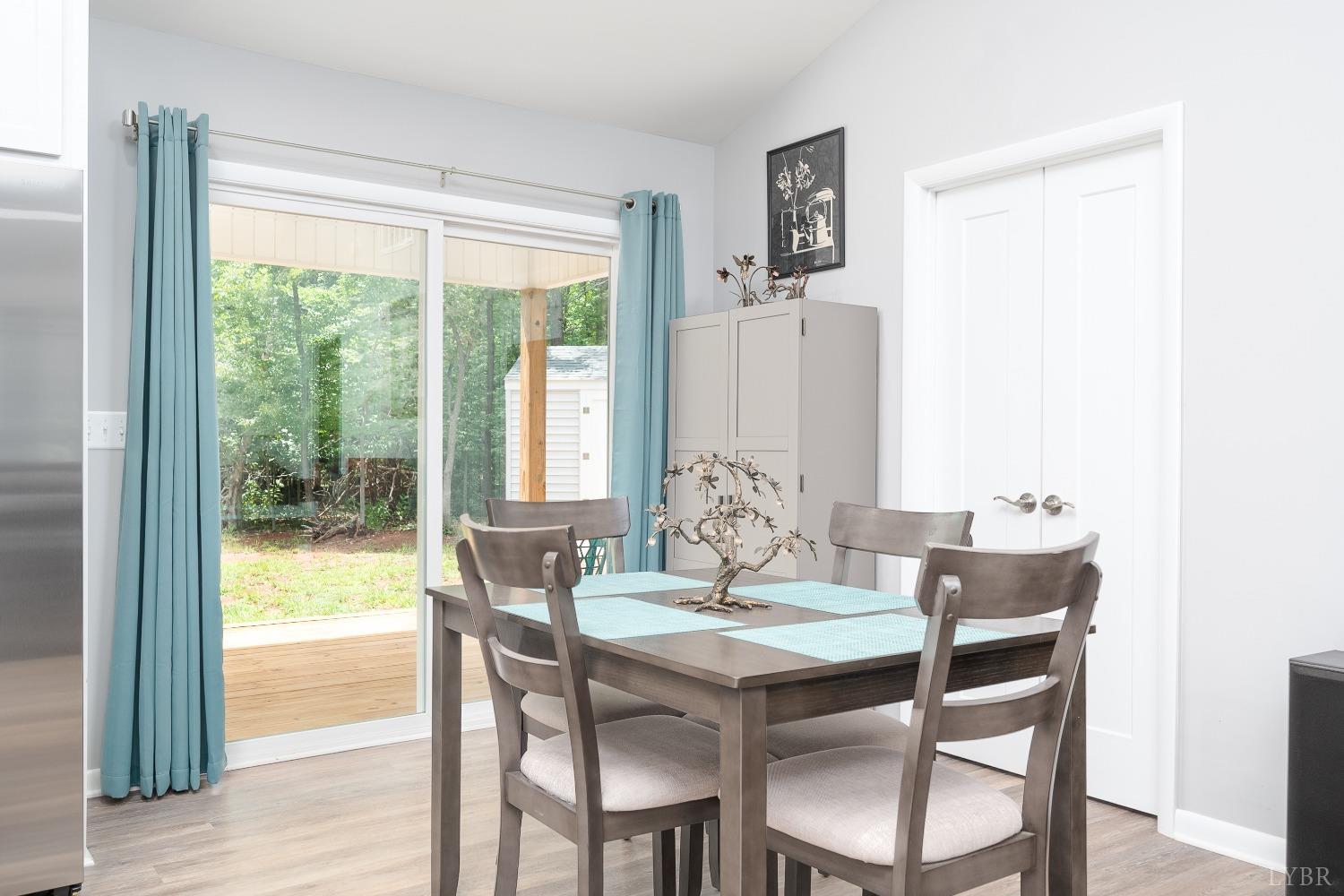 905 Gap Bridge Road Moneta, VA 24121 - Photo 17 of 48 a dining room with furniture and window