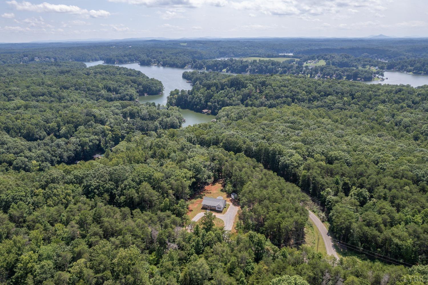 905 Gap Bridge Road Moneta, VA 24121 - Photo 2 of 48 an aerial view of a house with a yard