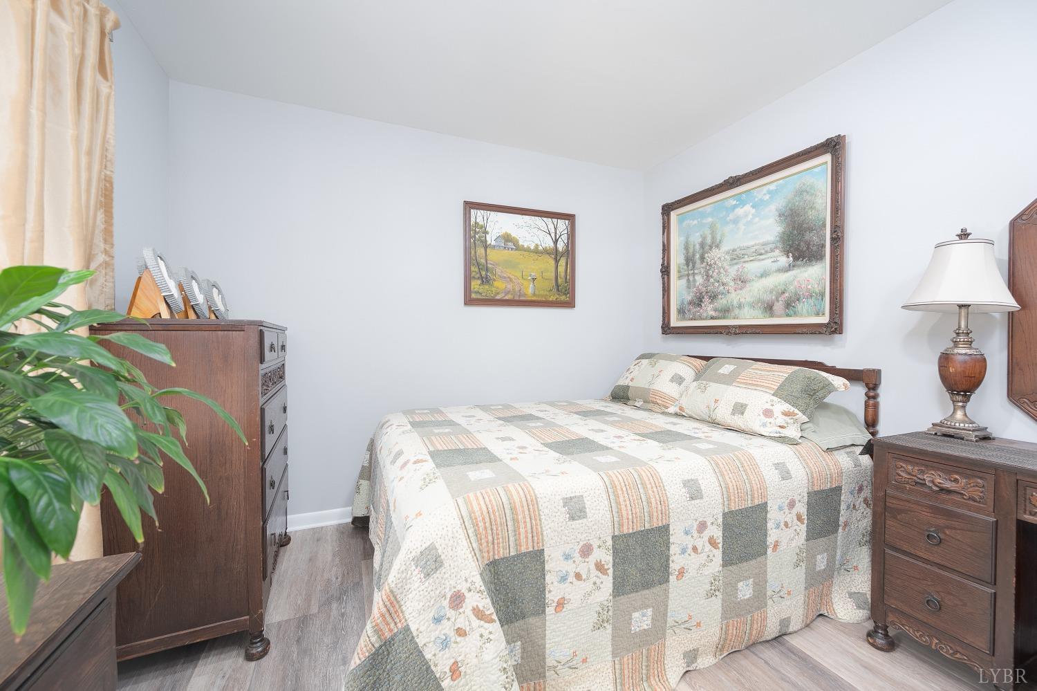 905 Gap Bridge Road Moneta, VA 24121 - Photo 26 of 48 a bedroom with a bed and a couch