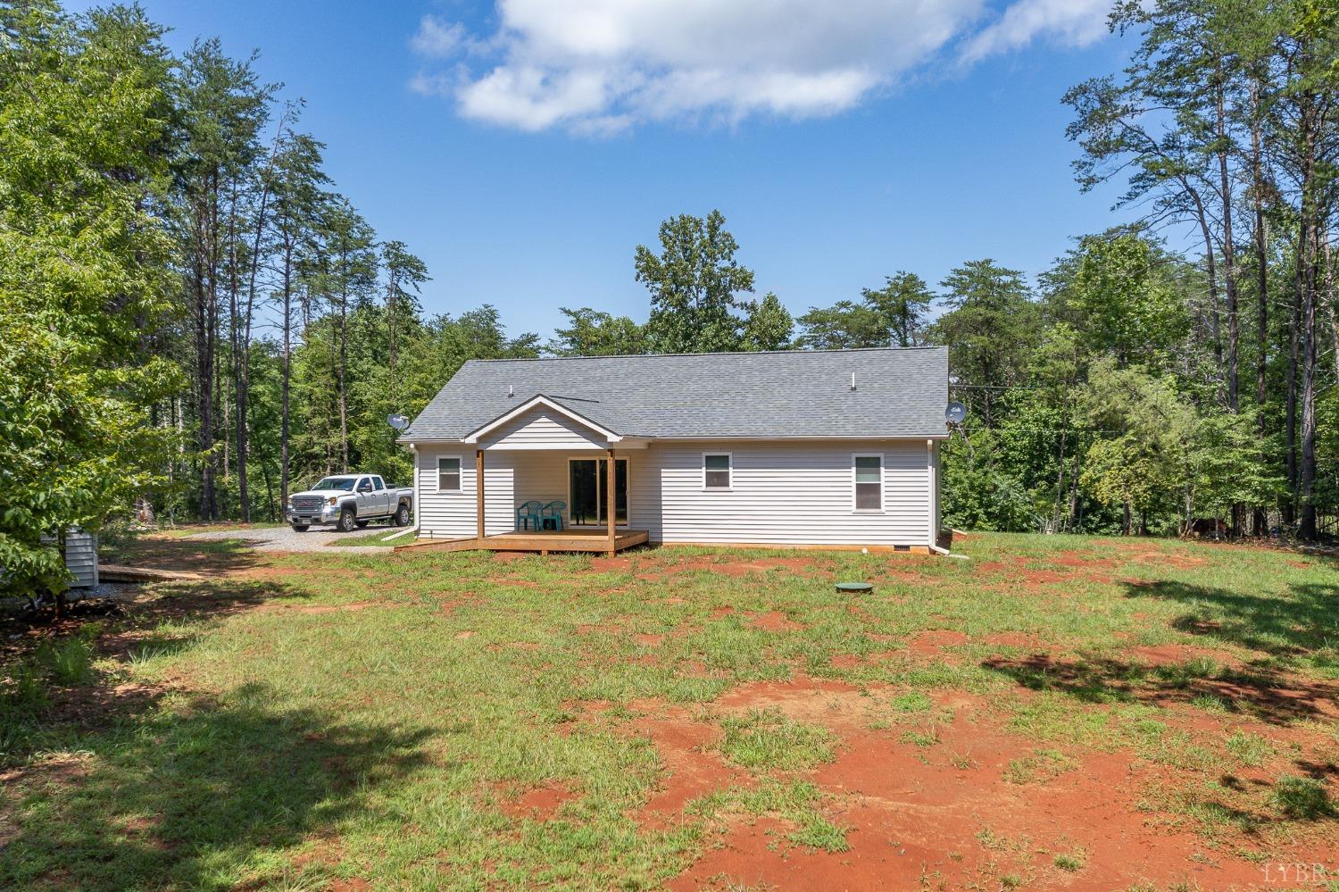 905 Gap Bridge Road Moneta, VA 24121 - Photo 33 of 48 a front view of a house with a yard and garage