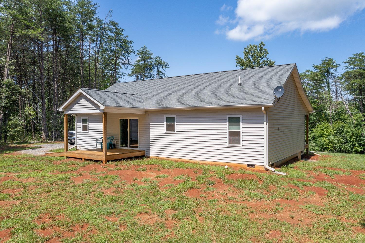 905 Gap Bridge Road Moneta, VA 24121 - Photo 34 of 48 a backyard of a house with table and chairs