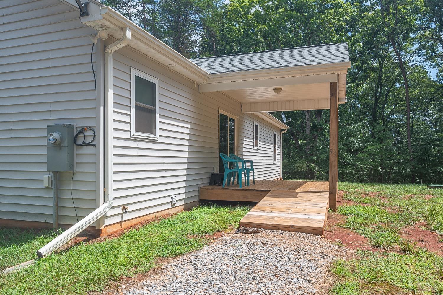 905 Gap Bridge Road Moneta, VA 24121 - Photo 35 of 48 a view of a house with backyard and a garden