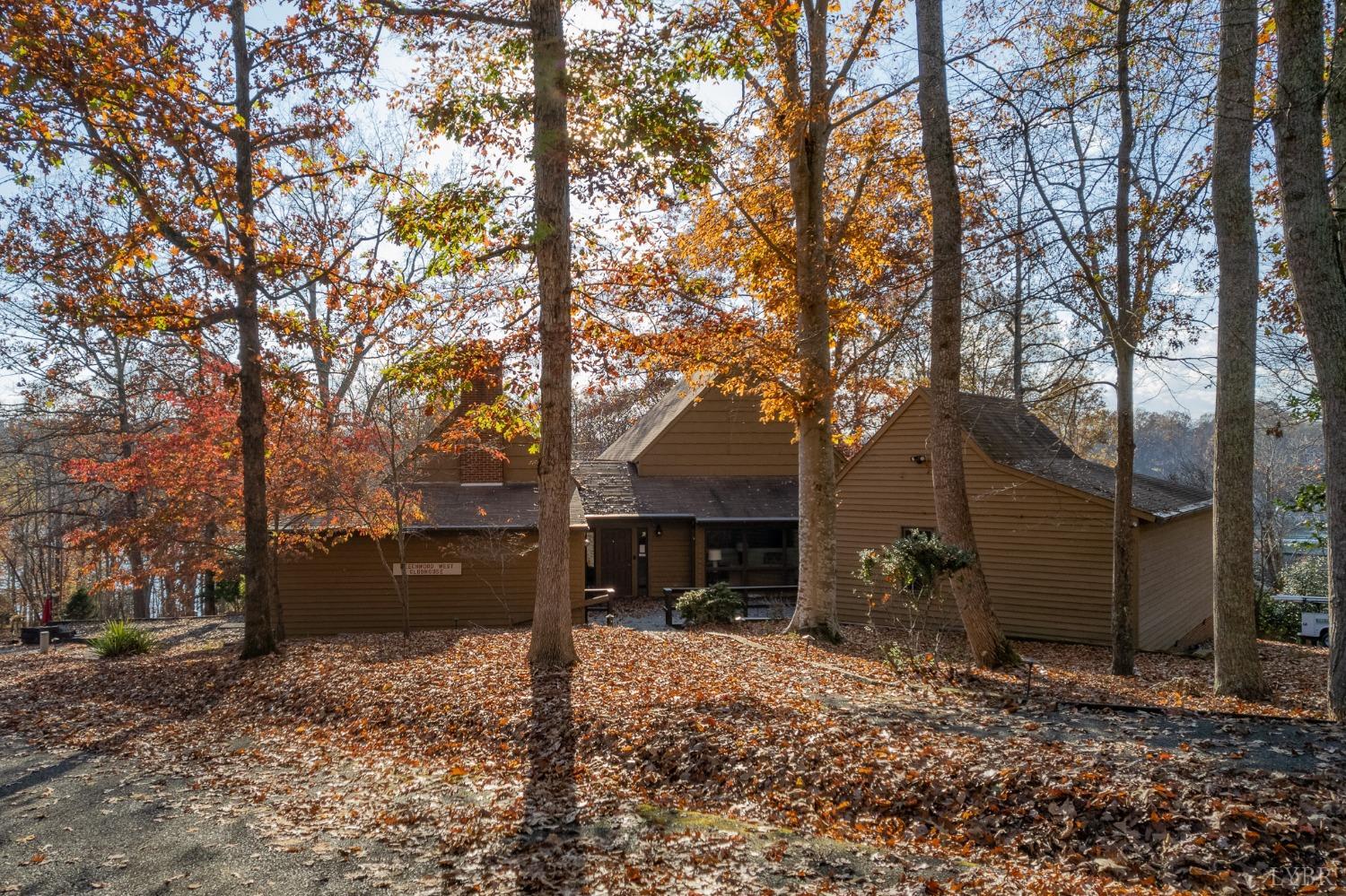 905 Gap Bridge Road Moneta, VA 24121 - Photo 44 of 48 a view of a house with a yard covered in the forest