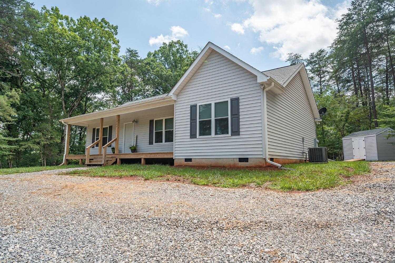 905 Gap Bridge Road Moneta, VA 24121 - Photo 7 of 48 a view of a house with a yard