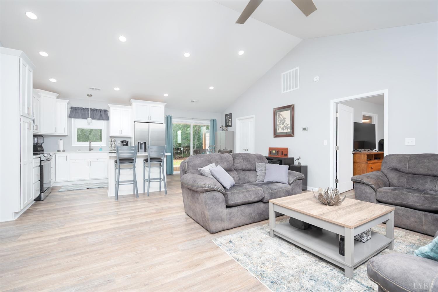 905 Gap Bridge Road Moneta, VA 24121 - Photo 9 of 48 a living room with furniture and view of kitchen