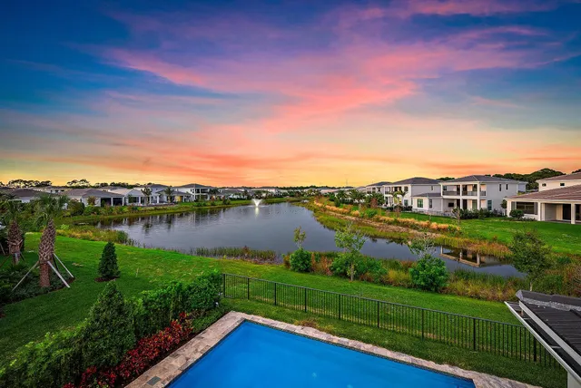 a view of a lake with a house in the background