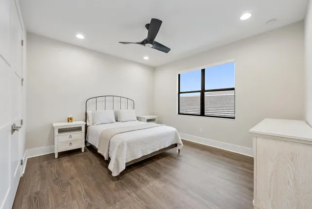 a bedroom with a bed and a window