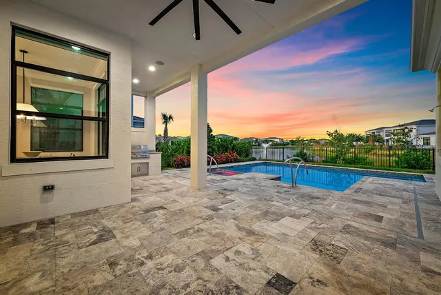 a front view of a house with yard and parking