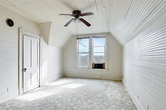 a room with a window and wooden floor