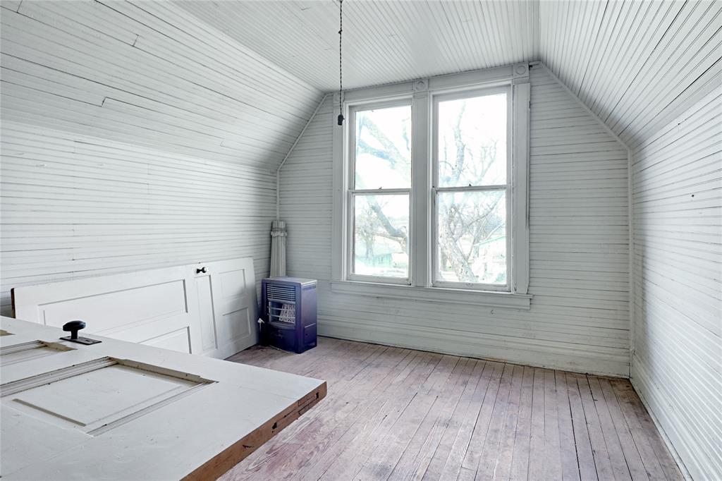 200 South Colorado Street Whitney, TX 76692 - Photo 25 of 38 a room with a window and wooden floor