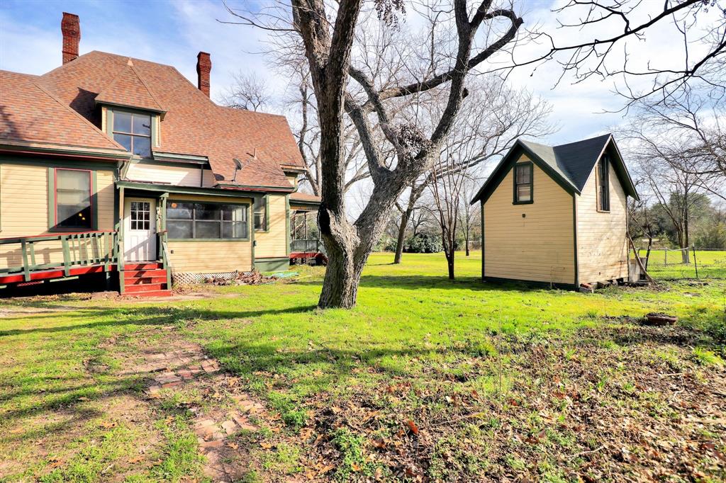 200 South Colorado Street Whitney, TX 76692 - Photo 34 of 38 a view of a yard with a house and a tree
