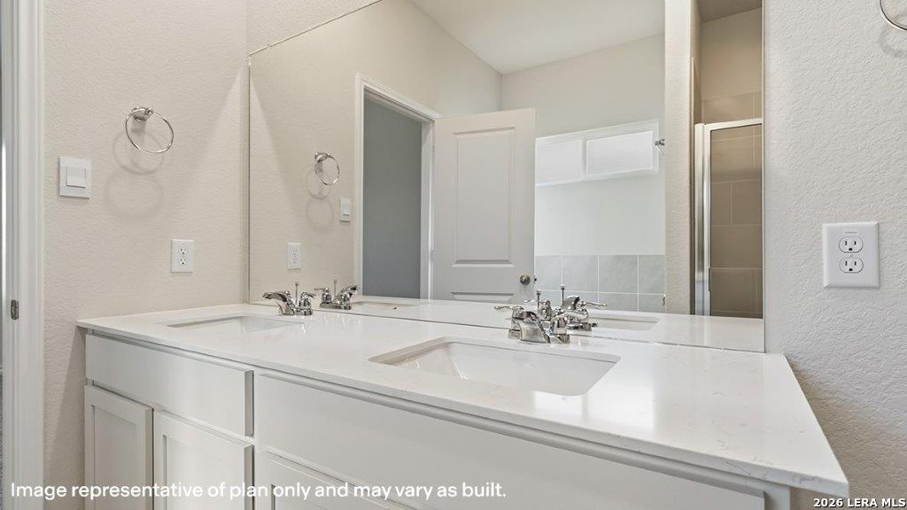 620 Fluted Shoals Cibolo, TX 78108 - Photo 23 of 44 a bathroom with a sink and a mirror