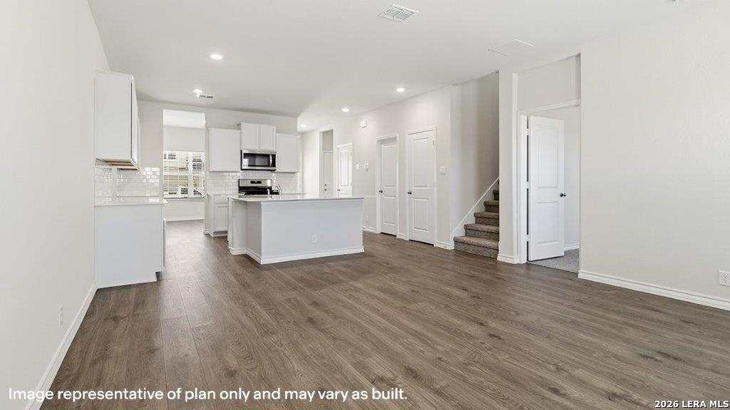 620 Fluted Shoals Cibolo, TX 78108 - Photo 4 of 44 a view of kitchen with wooden floor and electronic appliances