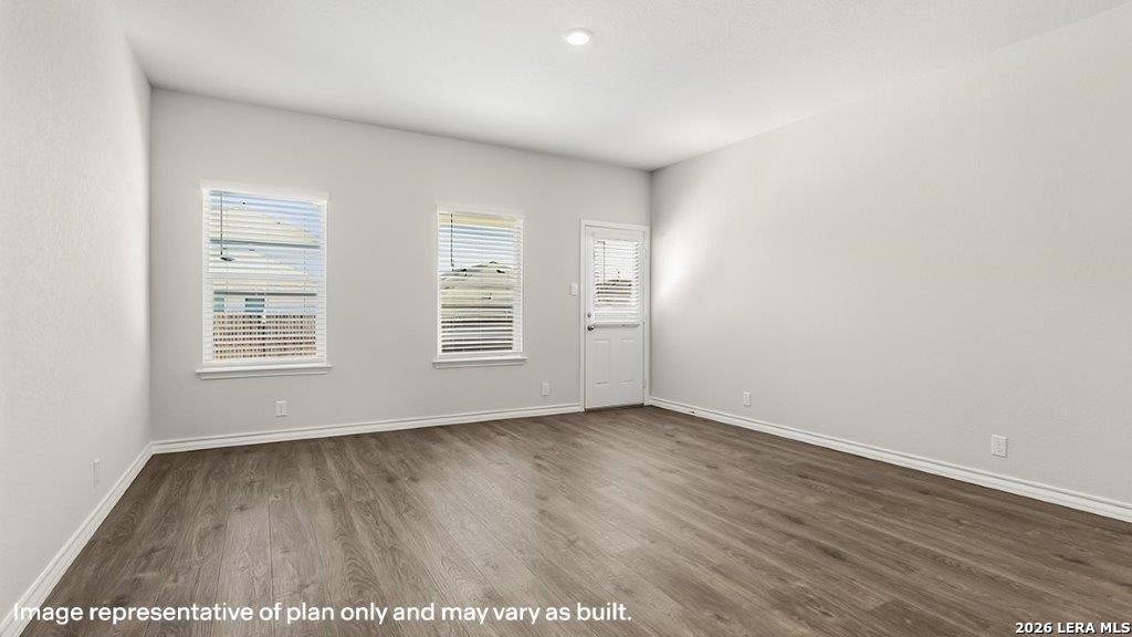 620 Fluted Shoals Cibolo, TX 78108 - Photo 6 of 44 an empty room with wooden floor and windows