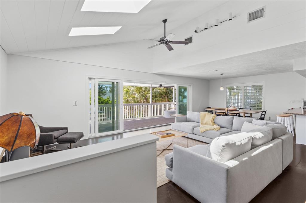 315 Spring Avenue Anna Maria, FL 34216 - Photo 5 of 63 a living room with furniture and large windows