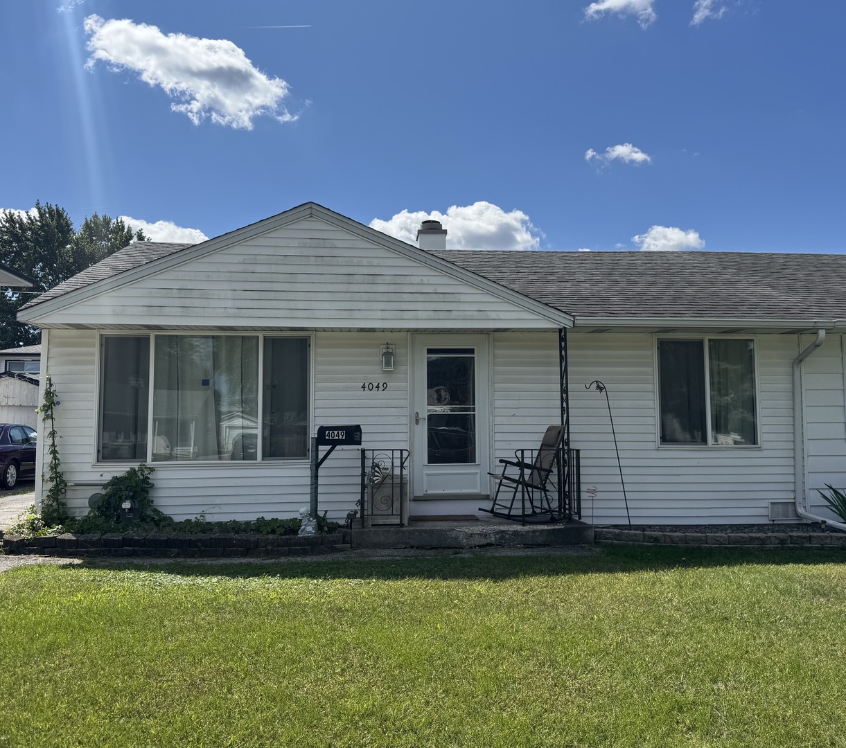 4049 West 89th Place Hometown, IL 60456 - Photo 1 of 11 a front view of house with yard and outdoor seating