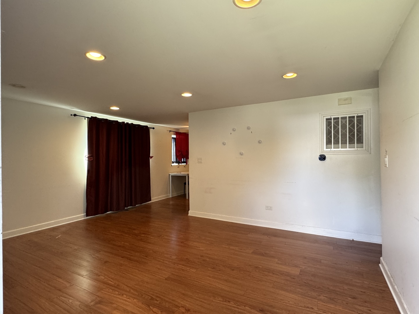 4049 West 89th Place Hometown, IL 60456 - Photo 2 of 11 a view of an empty room with wooden floor