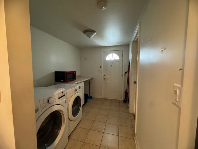 a view of a storage & utility room with washer and dryer