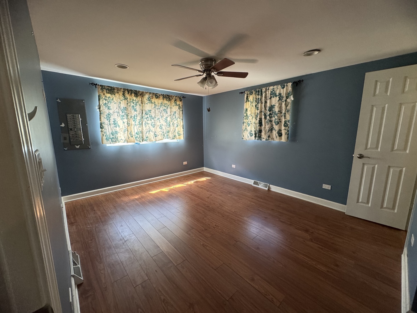 4049 West 89th Place Hometown, IL 60456 - Photo 7 of 11 wooden floor in an empty room with a window