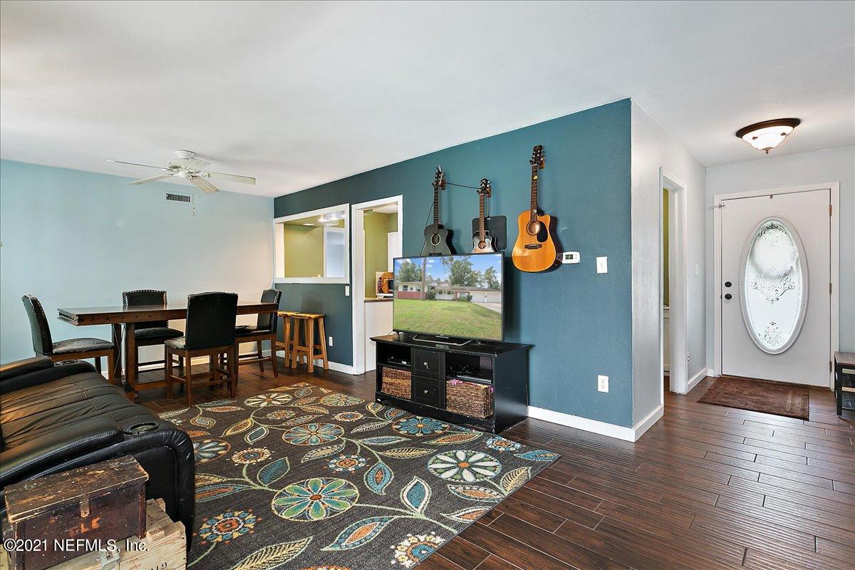 2040 Broward Road Jacksonville, FL 32218 - Photo 3 of 22 a living room with furniture a rug and a large window