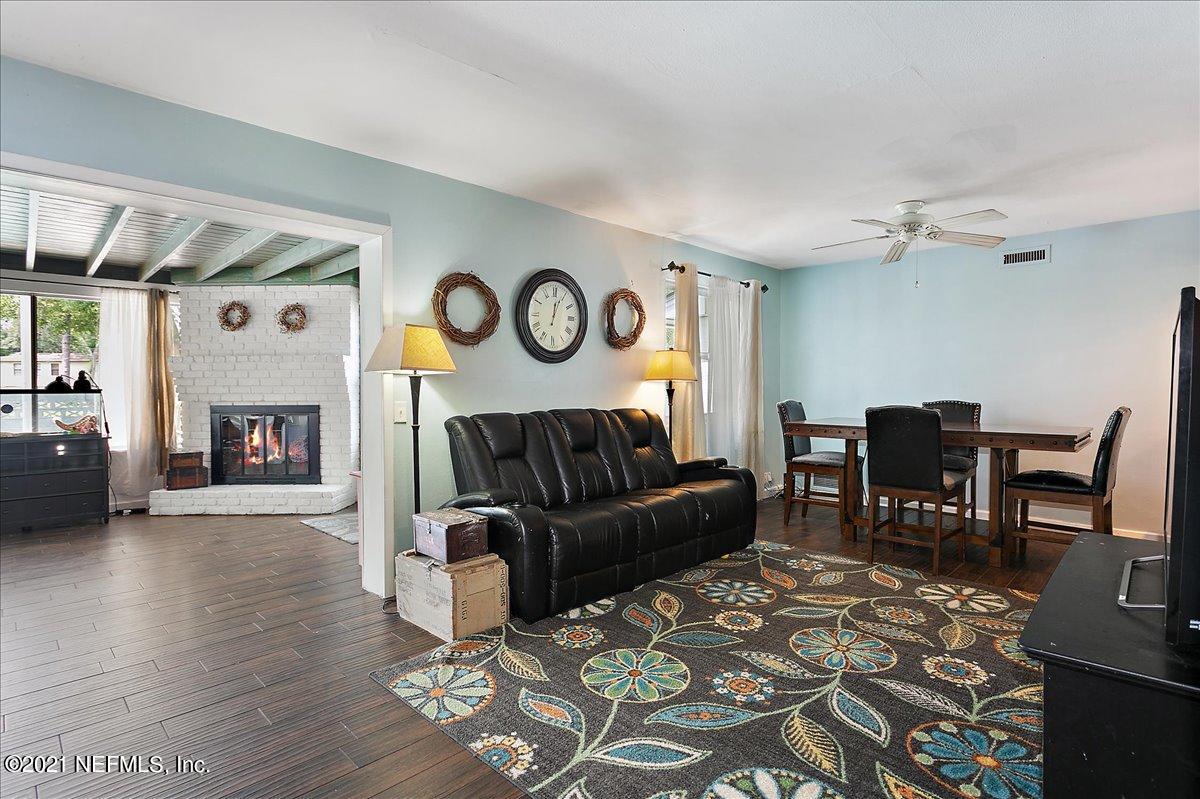 2040 Broward Road Jacksonville, FL 32218 - Photo 4 of 22 a living room with furniture and a fireplace