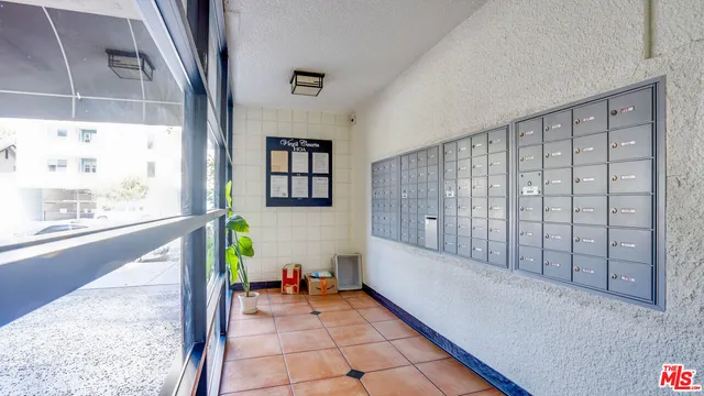 a view of an entryway with wooden floor and door