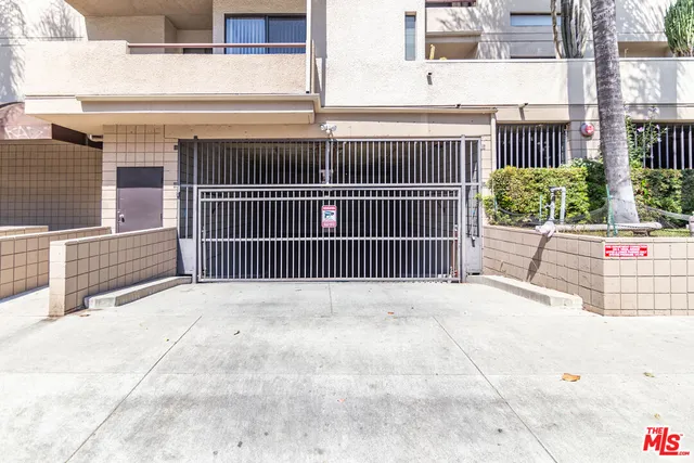a view of a balcony with a floor to ceiling window