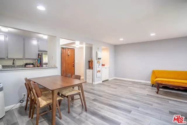 a workspace with furniture and wooden floor