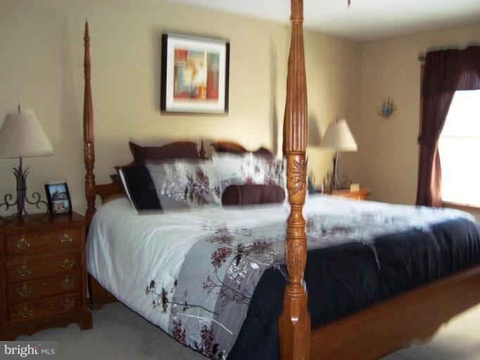 8166 N Road Severn, MD 21144 - Photo 12 of 25 a bedroom with bed and a window
