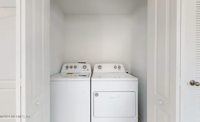 a utility room with dryer and washer