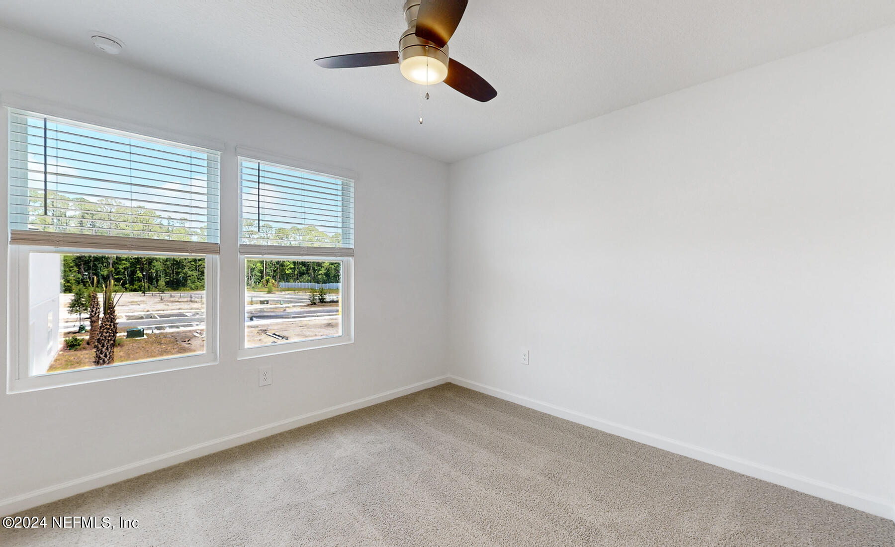 97 Hidden Mdws Road St. Augustine, FL 32095 - Photo 13 of 27 an empty room with a window