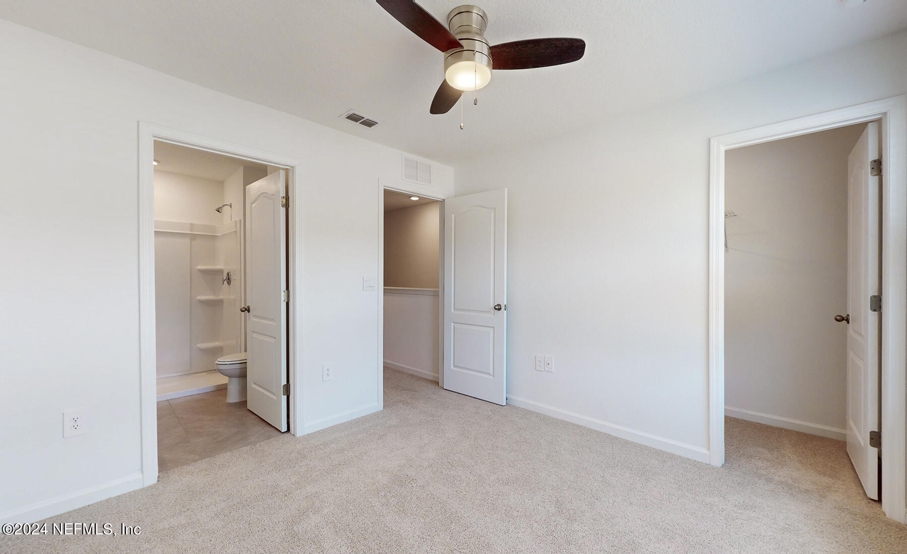 97 Hidden Mdws Road St. Augustine, FL 32095 - Photo 14 of 27 an empty room with closet and a ceiling fan