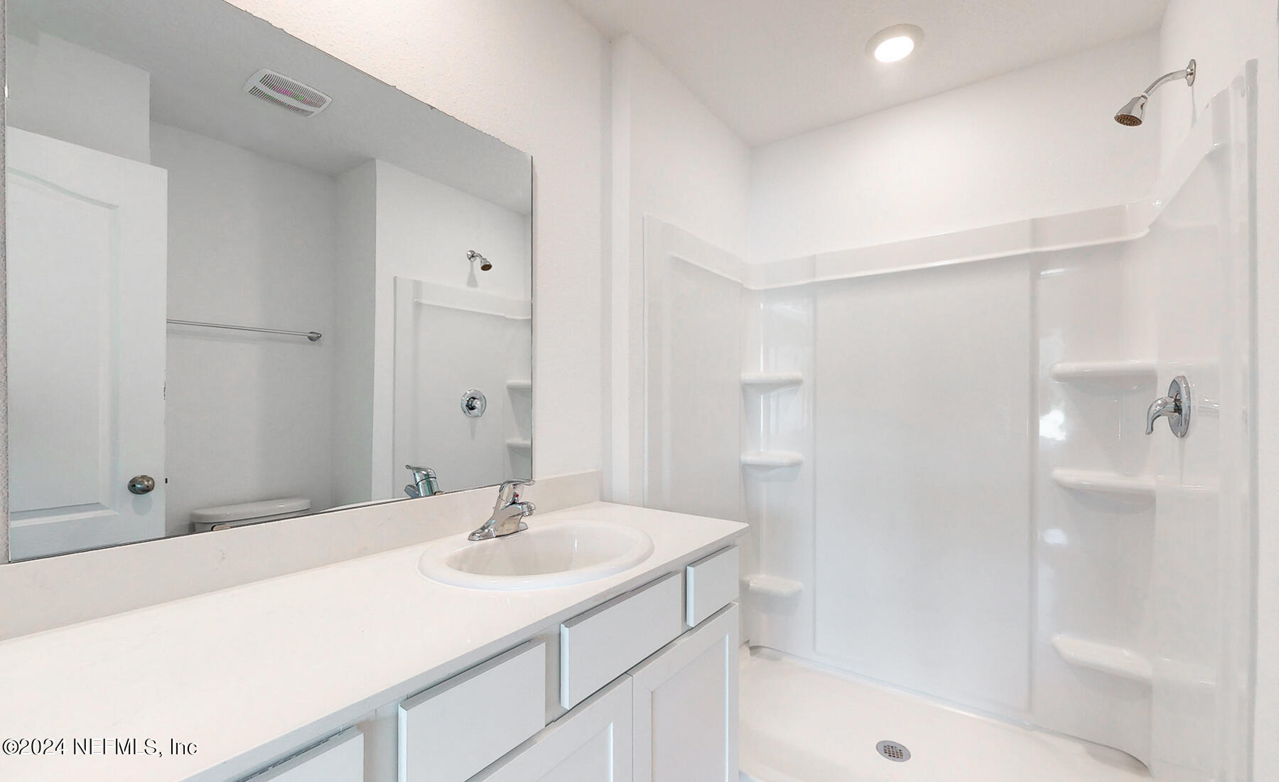 97 Hidden Mdws Road St. Augustine, FL 32095 - Photo 16 of 27 a bathroom with a sink shower and a mirror
