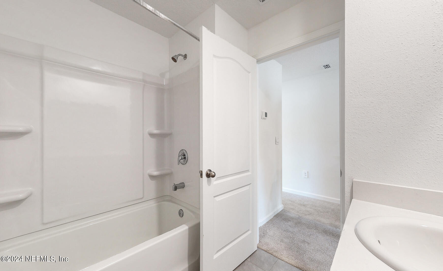 97 Hidden Mdws Road St. Augustine, FL 32095 - Photo 20 of 27 a bathroom with a bathtub and a shower