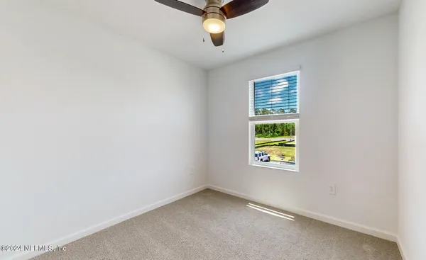 a view of an empty room with glass windows