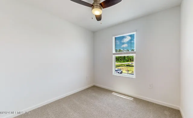 a view of an empty room with glass windows