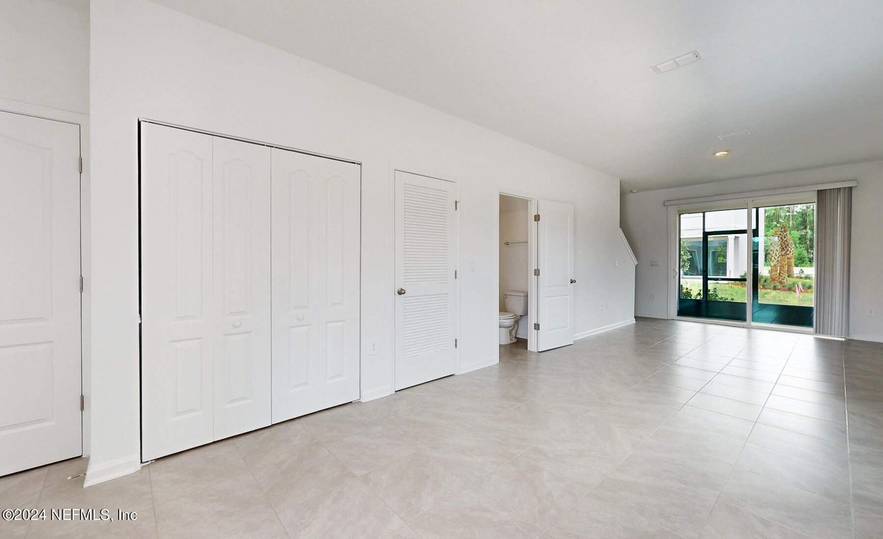 97 Hidden Mdws Road St. Augustine, FL 32095 - Photo 6 of 27 a view of an empty room with a window