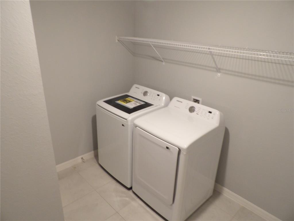 7653 Minardi Street North Port, FL 34291 - Photo 11 of 20 a utility room with dryer and washer