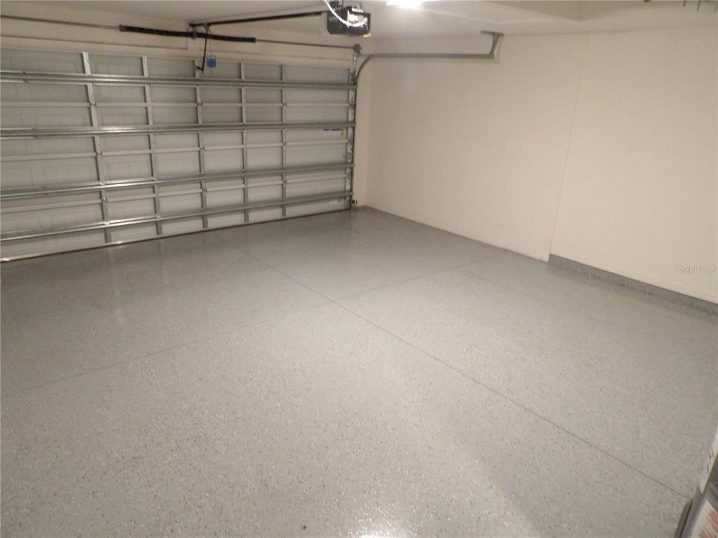 7653 Minardi Street North Port, FL 34291 - Photo 13 of 20 a view of a garage