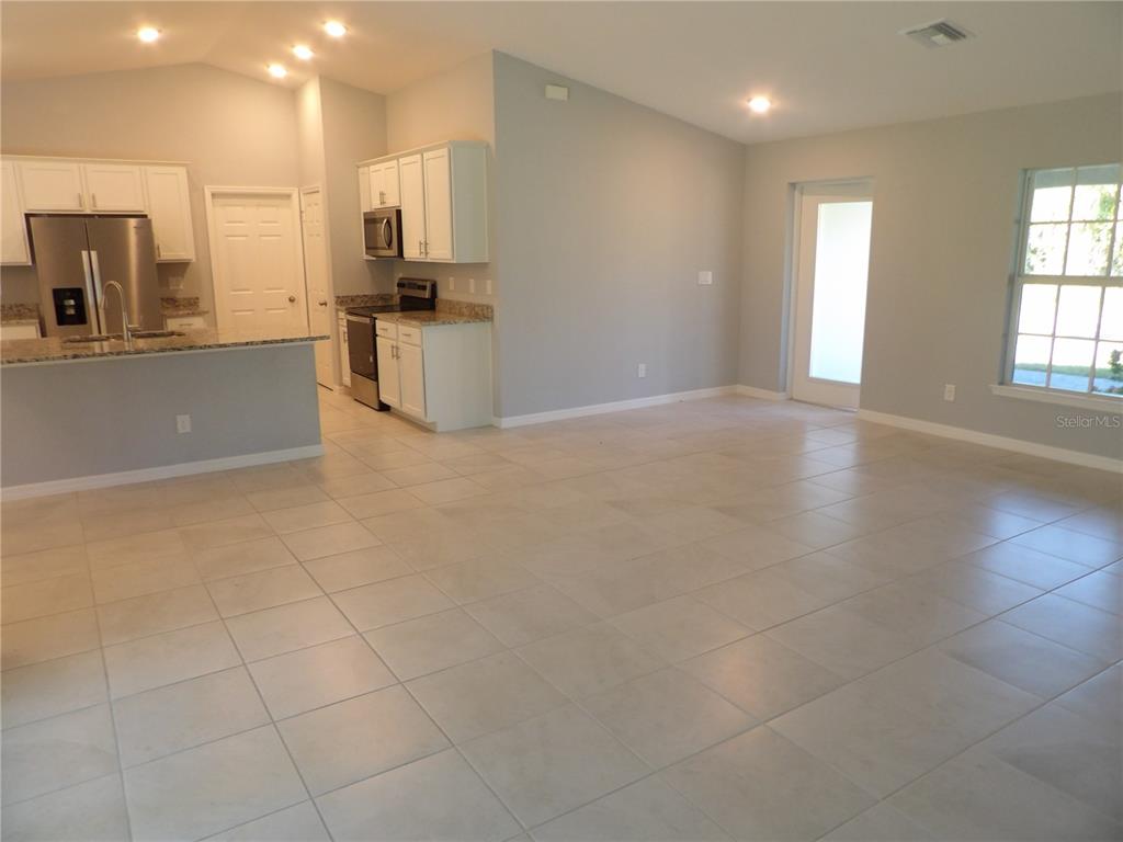 7653 Minardi Street North Port, FL 34291 - Photo 7 of 20 a view of a kitchen with a sink and a large window