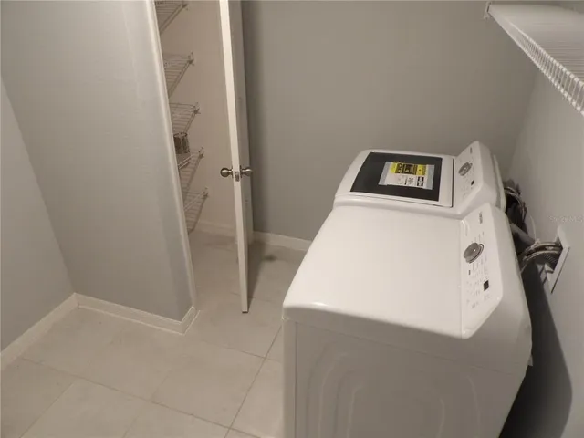 a utility room with a window dryer and washer