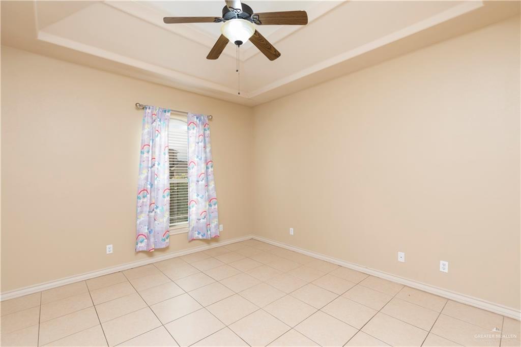 4212 Toronto Avenue McAllen, TX 78503 - Photo 13 of 15 an empty room with windows and fan