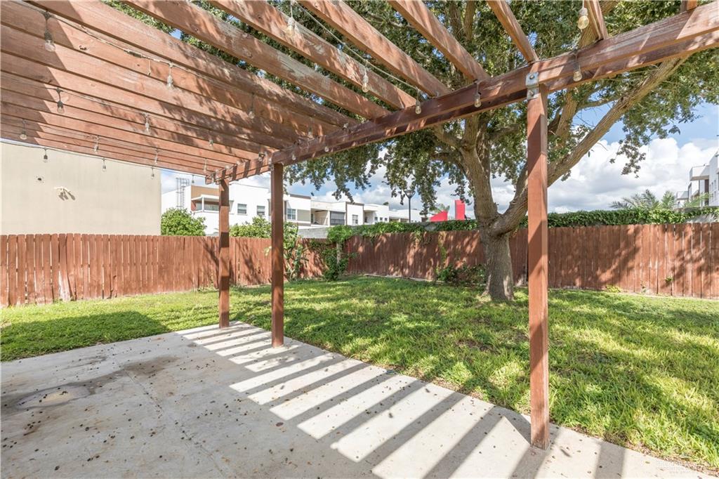 4212 Toronto Avenue McAllen, TX 78503 - Photo 15 of 15 a view of a backyard with wooden fence and a large tree