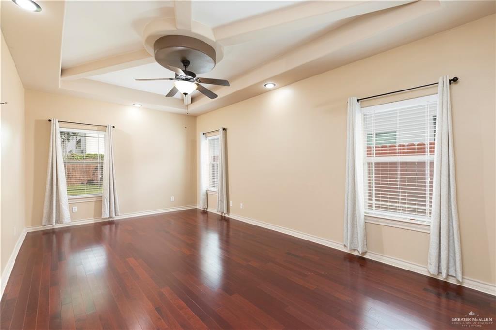 4212 Toronto Avenue McAllen, TX 78503 - Photo 8 of 15 a view of an empty room with wooden floor and a window